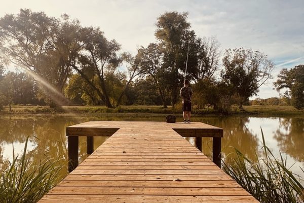 Fishing Pier with boy fishing